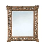 A carved wood wall mirror, 19th century,