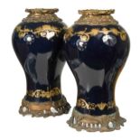 A large pair of gilt metal mounted Continental porcelain vases,