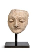 A Gandharan stucco fragmentary face of Buddha, North West India, 3rd-5th century,