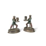 After Christophe Fratin, a pair of bronze candlesticks modelled as monkeys,