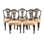 A set of five George III Hepplewhite style mahogany dining chairs,