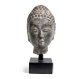 A Northern Qi -Sui Dynasty style black stone Buddha head,