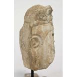 A Chinese stone fragmentary head of a Buddhist deity, Tang style,