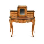 A gilt mounted walnut and ebonised serpentine writing desk, 19th century,