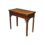 A George III mahogany fold over tea table,