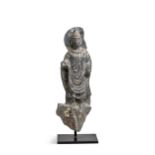 A Gandharan grey schist figure of a standing Buddha, 2nd/3rd century,