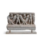 A Gandharan grey schist garlanded putti stair riser, 1st-3rd century,