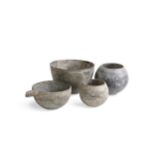 Four Chinese grey stone vessels, perhaps Han Dynasty,