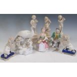 A pair of damaged German porcelain seated figures, pair of modern spaniels with gold anchor mark,