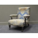 A Victorian ebonised low armchair,