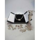 A silver necklace, together with a charm bracelet, twelve loose charms and a candle stick (15)