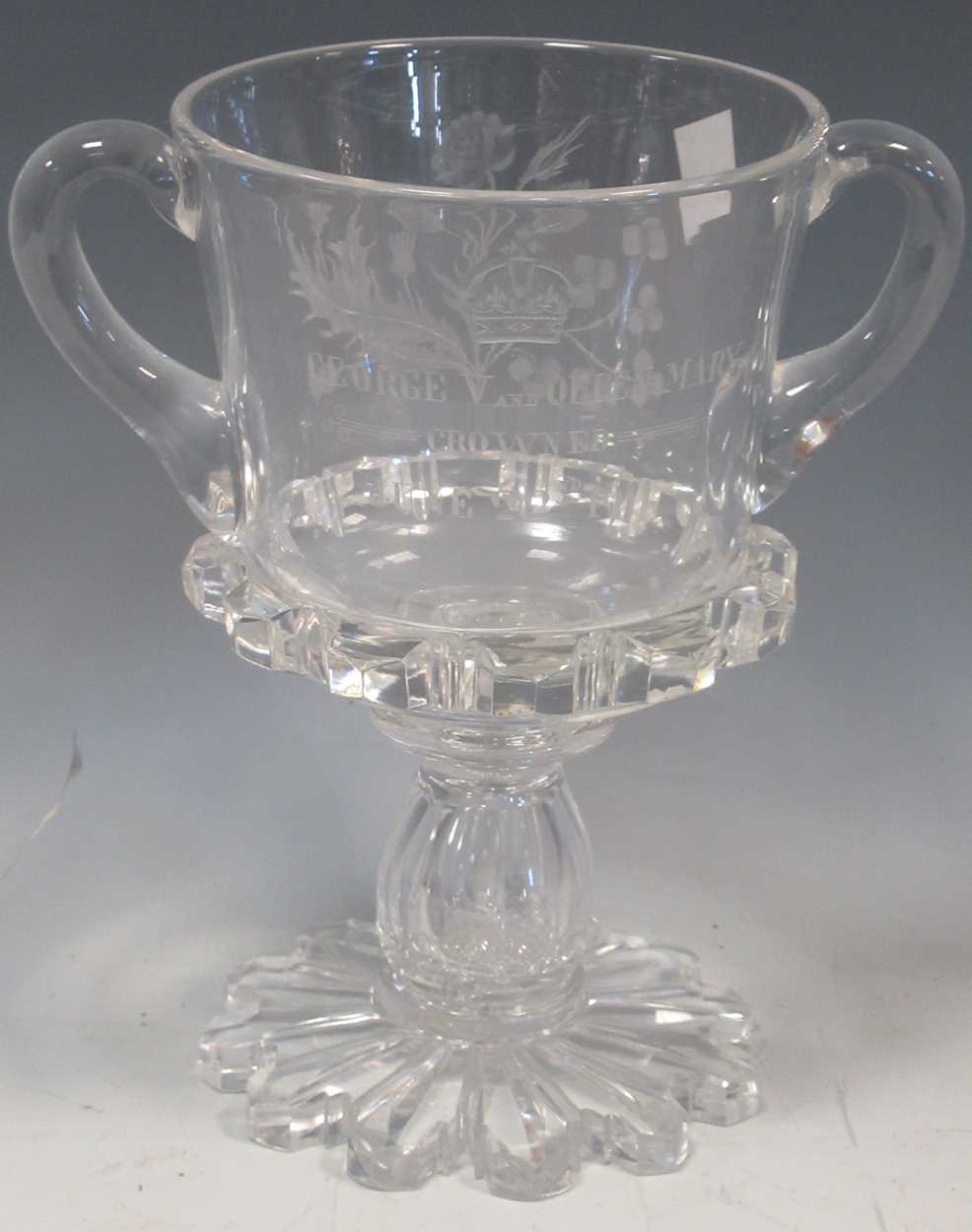 A 1911 George V and Queen Mary Coronation commemorative glass two handled vase with inset coin, 21cm