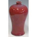 A flambe red vase with blue speckling, 19.5cm tallMiinor chip to the rim and roughness and grit to