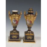 A pair of Vienna gilt decorated porcelain urns, 29cm high (with lid), missing lid broken but