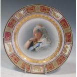 A Vienna porcelain plate with painted portrait of Queen Victoria (rim chip), 24.5cm diameter