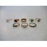 seven assorted rings, hallmarked 9ct gold, gross weight 15.4g, together with a white sapphire