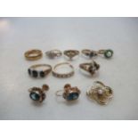 A collection of eight 9ct gold rings, together with a pair of ear studs and a brooch stamped '