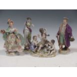 Continental figures to include a gentleman, a lady, a figural group of cherubs with a lamb, etc,