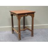 An Art Noveux occassional table with pierced heart shaped apron, 69 x 50 x 49cm