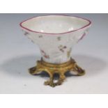A Meissen sweetmeat bowl. in the form of a blanc de Chine libation cup with flower painted moulded