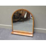 A large hall mantle mirror of arched form with single shelf, 84 x 74.5cm; together with another