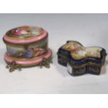 A Rococco style pink and gilt bound scent bottle holder, the oval hinged lid enclosing two scent