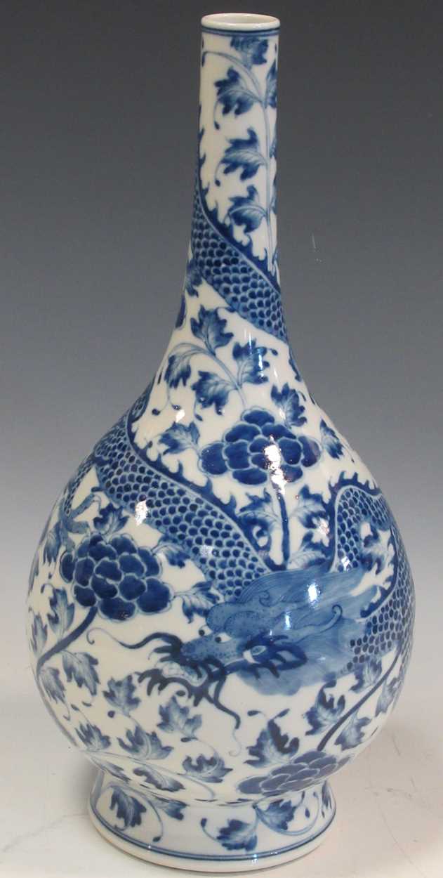 A blue and white vase decorated with a dragon and blossoms, 40cm
