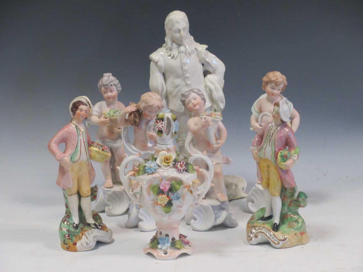 A set of four Portugese ceramic figures depicting the seasons together with a white glazed ceramic