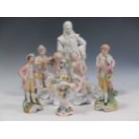 A set of four Portugese ceramic figures depicting the seasons together with a white glazed ceramic