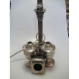 A pair of Victorian silver oil lamp bases, a silver candlestick converted to an electric lamp and