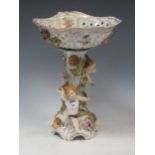 A Dresden ware ceramic table centrepiece with pierced floral decorated basket over a floral