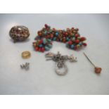 A small pair of diamond ear studs, a coral stick pin and various other costume jewellery