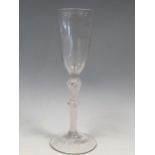 An 18th century ale glass, the trumphet shaped bowl on a double knopped air twist stem, 20.5cm