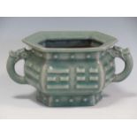 A celadon twin handled censor with chilong decorated handles, 9cm tall