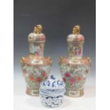 A pair of Chinese famille vert vase and covers, 56cm high; together with a blue and white lidded