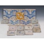 A collection of blue and white delft tiles and various other decorative titles