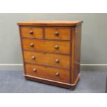 A late 19th century mahogany chest of two short over three long drawers with turned knob handles,