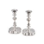 A pair of George II cast silver candlesticks, mark of George Wickes,