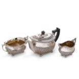 A George III silver harlequin three-piece tea set,