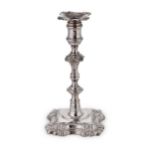 A George II cast silver candlestick, mark of John Cafe,