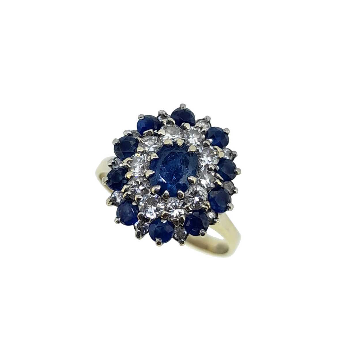 A late 20th century sapphire and diamond cluster ring,