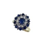 A late 20th century sapphire and diamond cluster ring,