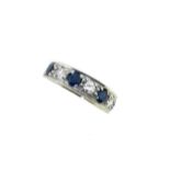 A late 20th century 18ct gold sapphire and diamond half hoop ring,