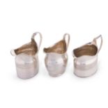 A trio of George III silver cream jugs,