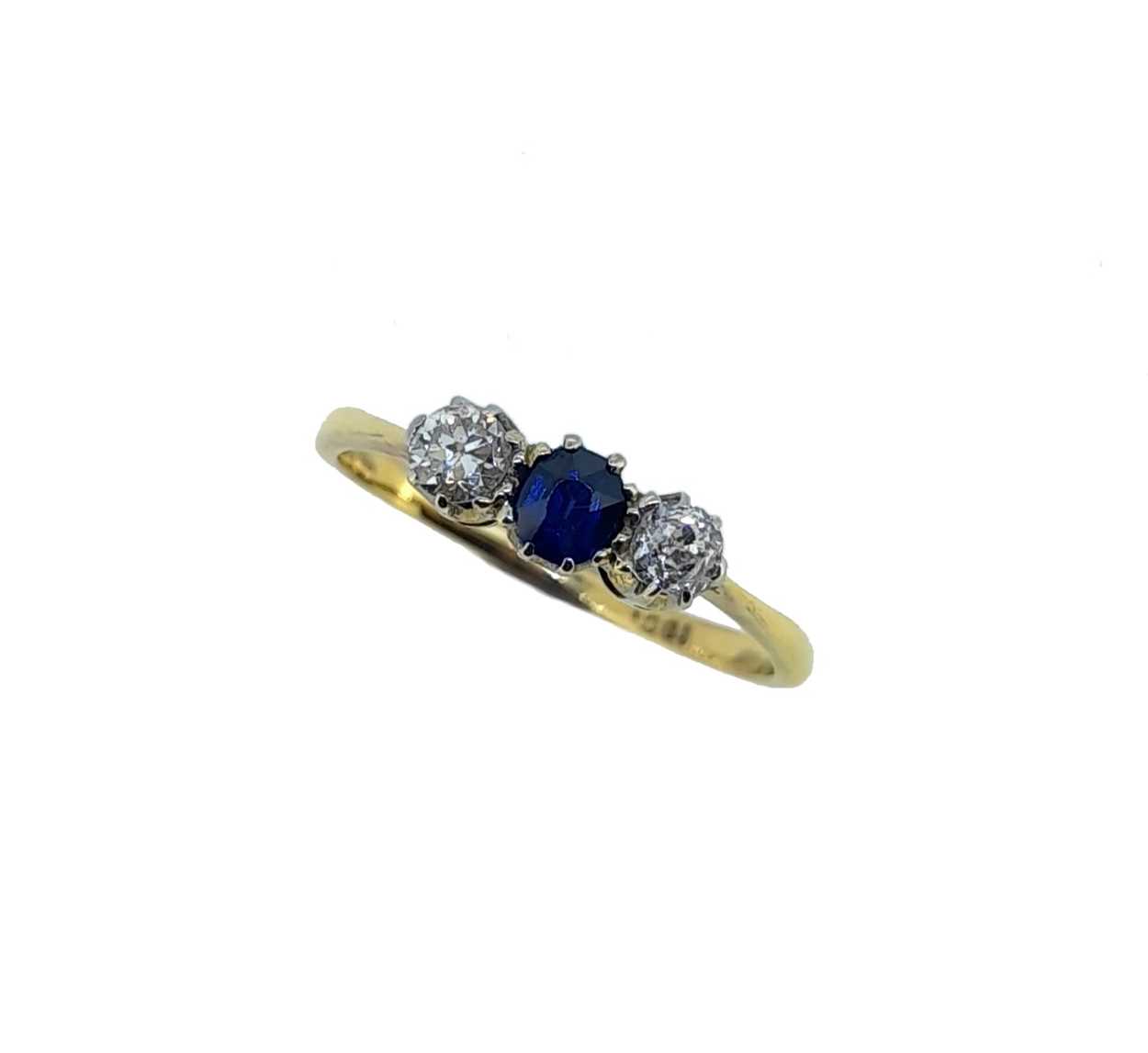 A sapphire and diamond three stone ring,