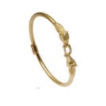 A hinged horse head bangle,