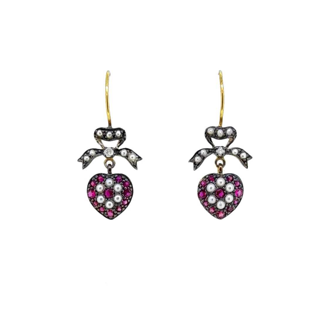 A pair of ruby and diamond heart shaped ear pendants,