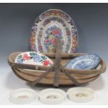 A selection of various large serving platters, a blue and white ginger jar, four decorative tiles,