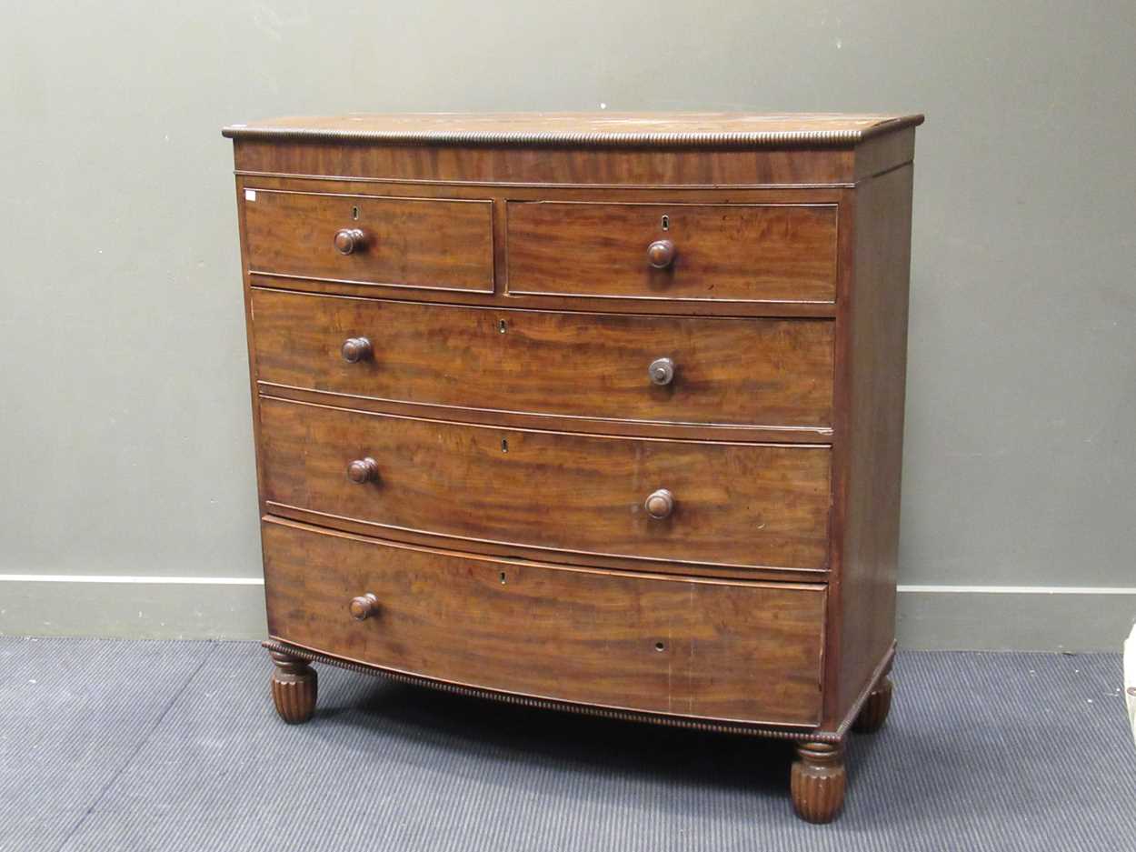 A Victorian bow fronted chest of drawers, with two short over three graduating long drawers, with