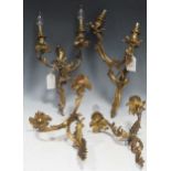 Two pairs of 19th century gilt wall lights in the rococo style, approx 35cm high